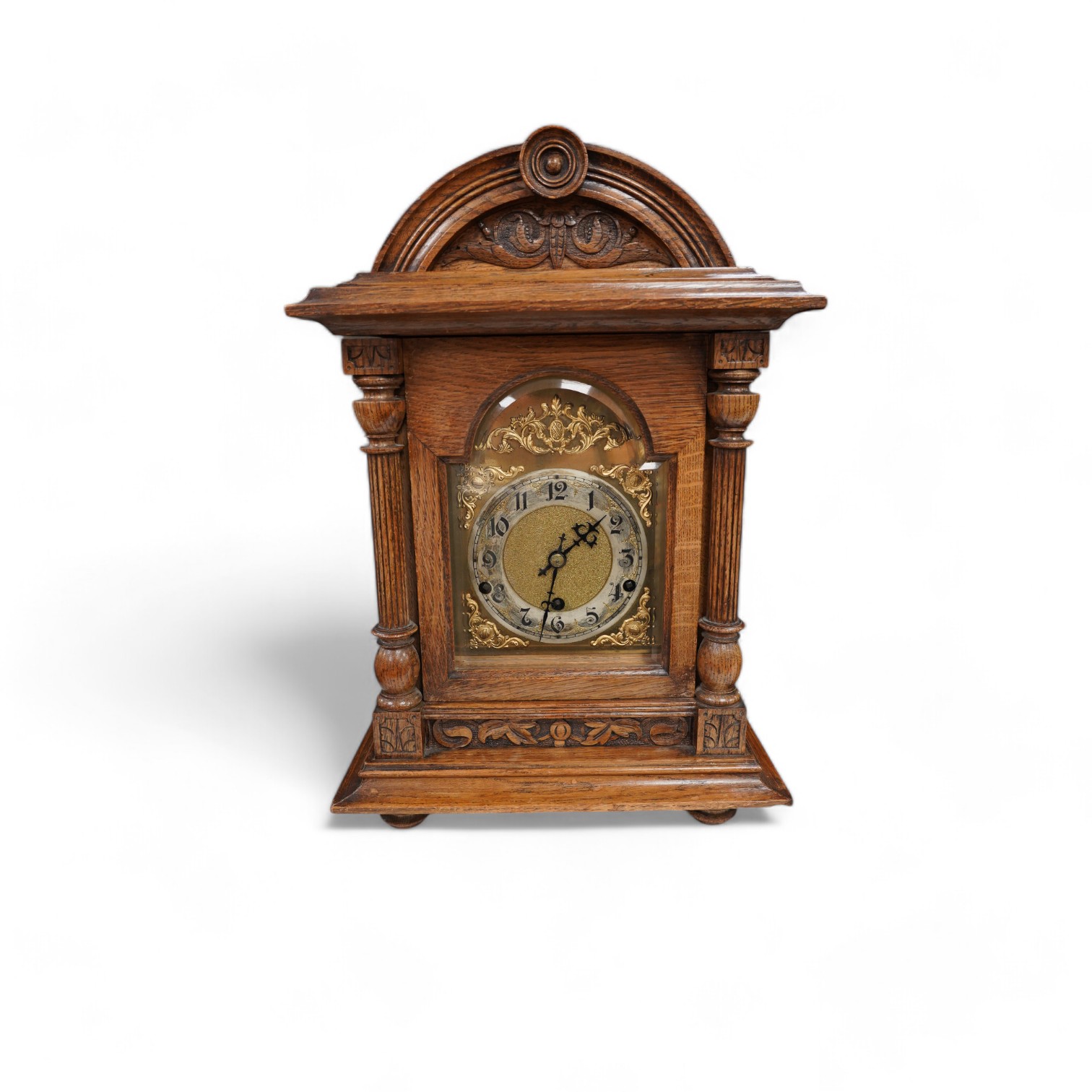 An oak bracket clock with a German three train movement, chiming on five gongs, 47cm high. Condition - fair to good, some wear to chapter ring, etc.